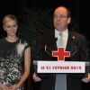 Le prince Albert II de Monaco pendant son discours et sa femme la princesse Charlene lors de la cérémonie de la Croix-Rouge, à Monaco, le 21 février 2012