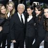 Paul Marciano et ses Guess Girls à Paris, le 3 mai 2012.