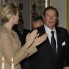 Charlene de Monaco et Roger Moore au dîner du Club des Ambassadeurs, organisé à l'Hôtel de Paris à Monaco, le 12 juin 2012.