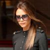 Victoria Beckham en Victoria Beckham et bottes Tom Ford à Londres. Le 26 juin 2012.