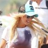 Tara Reid rayonnante le 24 juillet 2012, quelques jours après son hospitalisation en sortant du Club 55 à Saint-Tropez