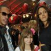 JoeyStarr, Karole Rocher et sa fille à l'Espace Commines où Karl Lagerfeld présentait sa collection spéciale pour la marque de cosmétiques Shu Uemura, à Paris, le 11 septembre 2012.