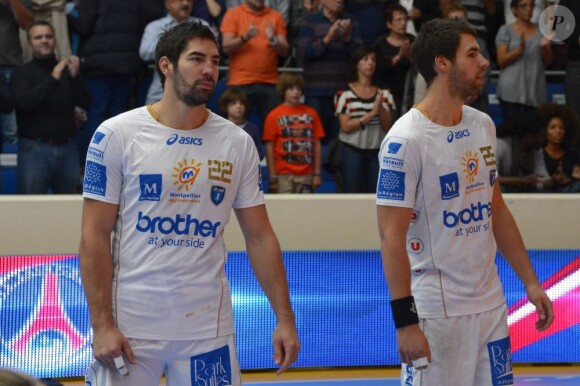 Nikola et Luka Karabatic lors du match entre le PSG Handball et Montpellier au stade Pierre de Coubertin le 30 septembre 2012