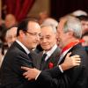 François Hollande félicite Jerôme Clement, ancien président de Arte et fait commandeur de la Legion d'honneur à l'Elysée le 26 novembre 2012.