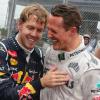 Sebastian Vettel en compagnie de Michael Schumacher, après avoir glané son troisième titre de champion du monde à Interlagos au Brésil le 25 novembre 2012, devenant le plus jeune triple champion du monde de l'histoire