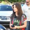 Kim Kardashian dégaine les accessoires bling lors de son retour à Miami. Le 3 décembre 2012