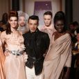 Le séduisant Julien de Secret Story 6 défile pour la collection Haute Couture printemps-été du couturier Eric Tibusch à l'hôtel d'Evreux in Paris, le 21 janvier 2013
