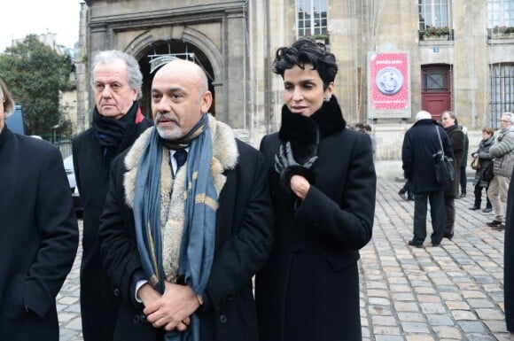 Christian Louboutin et Farida Khelfa lors des obsèques d'Andrée Putman en l'Eglise Saint-Germain-des-Prés, le 23 janvier 2013.