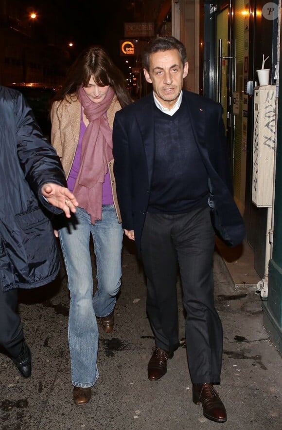 Nicolas Sarkozy et Carla Bruni lors de l'anniversaire du premier le 28 janvier 2013 au restaurant Giulio Rebellato à Paris