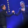 Nikos Aliagas et Laurent Ruquier sur la scène de Bobino pour la grande soirée humoristique "Europe 1 fait Bobino", le 18 février 2013