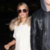 Paris Hilton et Riper Viiperi arrivent à l'aéroport LAX de Los Angeles, le 2 février 2013.
