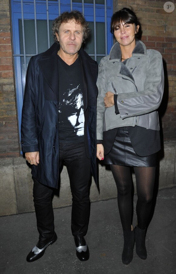 Renzo Rosso et son amie Arianna Lessi arrivent au gymnase Japy pour le défilé Maison Martin Margiela. Paris, le 1er mars 2013.