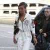 Rihanna, habillée d'une combinaison DKNY for Opening Ceremony, de souliers Alexander Wang et d'un sac Joyrich, arrive à l'aéroport de Los Angeles pour prendre un vol à destination de Londres. Le 3 mars 2013.