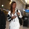 Rihanna, habillée d'une combinaison DKNY for Opening Ceremony, de souliers Alexander Wang et d'un sac Joyrich, arrive a l'aéroport de Los Angeles pour prendre un vol à destination de Londres. Le 3 mars 2013.