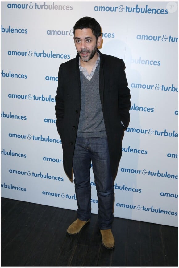 Manu Payet au photocall à la première du film Amour & Turbulences au Publicis, Paris, le 18 mars 2013.