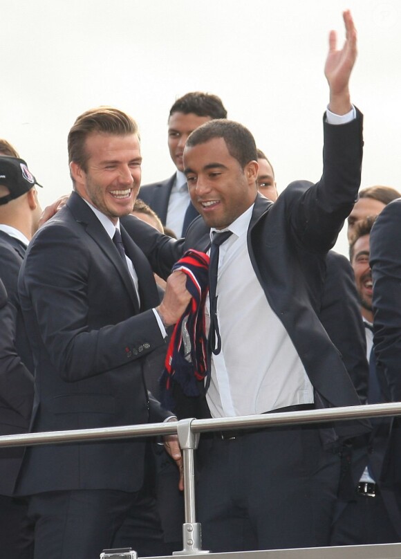 David Beckham et Lucas quittent le Parc des Princes pour fêter le titre de Champion de France au Trocadero à Paris le 13 mai 2013.