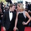 Laurence Ferrari et son mari Renaud Capuçon, complices, à la montée des marches du film Le Passé, lors du 66e Festival du film de Cannes, le 17 mai 2013.