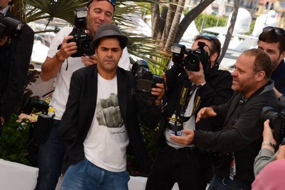 Jamel Debbouze pendant le photocall de Né Quelque Part au Palais des Festivals, le 21 mai 2013.