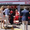 Pierre Casiraghi et sa compagne Beatrice Borromeo font une halte devant les stands de la Scuderia Ferrari avant le Grand Prix de F1 de Monaco le 26 mai 2013