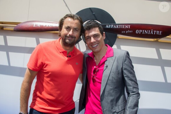 Henri Leconte et Taïg Khris dans les allées du Village de Roland-Garros le 27 mai 2013 lors du second jour des Internationaux de France