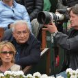 Dominique Strauss-Kahn et Myriam L'Aouffir dans les tribunes du tournoi de Roland-Garros 2013 pour la finale opposant Rafael Nadal à David Ferrer, à Paris le 9 juin 2013.