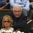 Dominique Strauss-Kahn et Myriam L'Aouffir dans les tribunes du tournoi de Roland-Garros 2013 pour la finale opposant Rafael Nadal à David Ferrer, à Paris le 9 juin 2013.