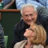 Dominique Strauss-Kahn et Myriam L'Aouffir, complices et sereins, dans les tribunes du tournoi de Roland-Garros 2013 pour la finale opposant Rafael Nadal à David Ferrer, à Paris le 9 juin 2013.