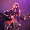 Carla Bruni invitée sur la scène des Folies Bergère à Paris, pour les 32 ans de RFM, le 10 juin 2013.