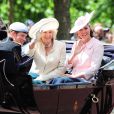 Le prince Harry avec Kate Middleton, enceinte et en Alexander Mc Queen, et Camilla Parker Bowles le 15 juin 2013, lors de la procession de la famille royale à l'occasion de la parade Trooping the Colour, à la gloire des forces armées et de l'anniversaire de la souveraine, Elizabeth II.