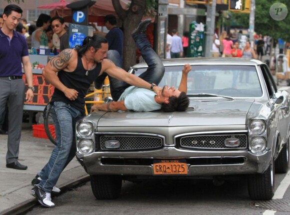 Taylor Lautner se bat sur le tournage du film Tracers à New York, le 24 Juin 2013.