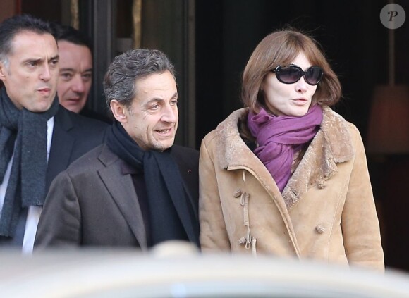 Nicolas Sarkozy et Carla Bruni à la sortie du Royal Monceau à Paris, le 9 fevrier 2013.