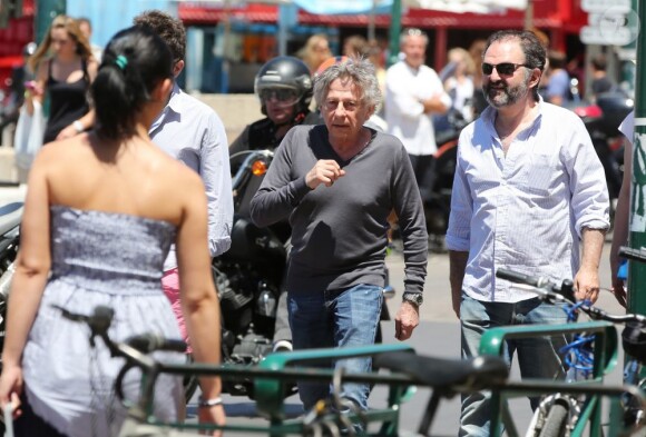 Le réalisateur Roman Polanski, sa femme Emmanuelle Seigner et Denis Olivennes sur le port de Saint-Tropez, le 30 Juin 2013.