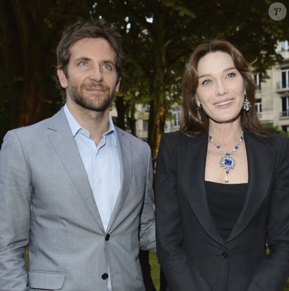 Carla Bruni et Bradley Cooper - soirée Bulgari pour la collection Diva à l'Hôtel Potocki à Paris, le 2 juillet 2013.