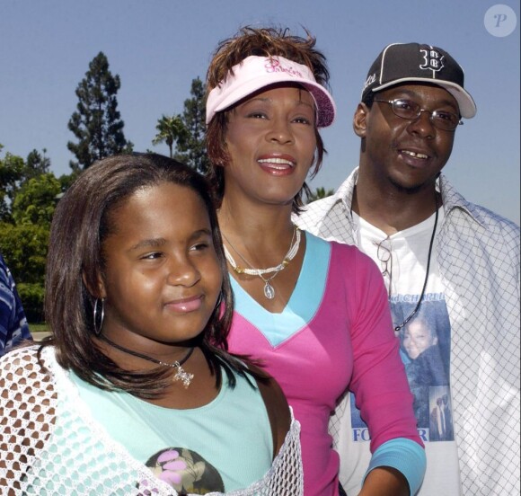 Whitney Houston avec Bobby Brown et sa fille Bobbi Kristina à Anaheim, le 7 août 2004.