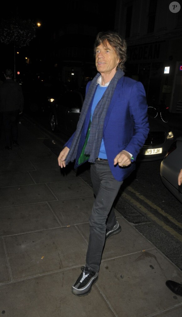Mick Jagger et sa compagne L'wren Scott à la sortie du "Groucho Club" à Londres, le 26 juin 2013.