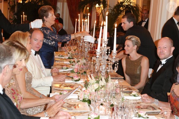 Le prince Albert II et sa femme la princesse Charlene de Monaco lors du dîner de la soirée de bienfaisance pour les 40 ans du Club Allemand International de Monaco, marquée par un défilé de la marque Basler, le 30 juillet 2013 à l'Hôtel Hermitage de Monte-Carlo. Photo BestImage/Frederic Nebinger
