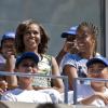 Michelle Obama et ses filles, Sasha et Malia, dans les tribunes pour le Arthur Ashe Kids' Day à New York, le 24 août 2013.