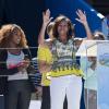 Devant une Serena Williams très attentive, Michelle Obama prend la parole à l'occasion du Arthur Ashe Kids' Day à New York, le 24 août 2013.