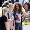 Devant une Serena Williams très attentive, Michelle Obama prend la parole à l'occasion du Arthur Ashe Kids' Day à New York, le 24 août 2013.