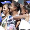 Michelle Obama et ses filles, Sasha et Malia, dans les tribunes pour le Arthur Ashe Kids' Day à New York, le 24 août 2013.