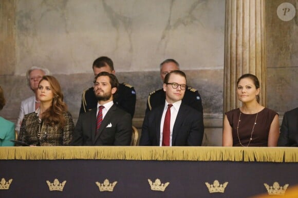 Madeleine de Suède enceinte et son frère Carl Philip, la princesse héritière Victoria de Suède et le prince Daniel de Suède lors de l'inauguration de l'exposition "40 ans sur le trône, 40 ans au service de la Suède" dans le cadre du jubilé des 40 ans de règne du roi Carl XVI Gustaf à Stockholm, le 13 septembre 2013