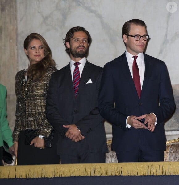 Madeleine de Suède, enceinte, et son frère Carl Philip lors de l'inauguration de l'exposition "40 ans sur le trône, 40 ans au service de la Suède" dans le cadre du jubilé des 40 ans de règne du roi Carl XVI Gustaf à Stockholm, le 13 septembre 2013