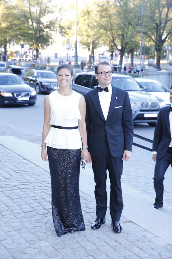 La princesse héritière Victoria de Suède et son époux, le prince Daniel lors du dîner au musée nordique, dans le cadre du jubilé des 40 ans de règne du roi Carl XVI Gustaf à Stockholm le 14 septembre 2013