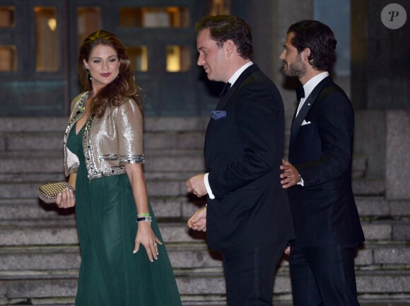 La princesse Madeleine de Suède, enceinte, son mari Chris O'Neill et le prince Carl Philip de Suède lors du concert de la diète royale (le parlement suédois) dans le cadre du jubilé des 40 ans de règne du roi Carl XVI Gustaf à Stockholm le 14 septembre 2013