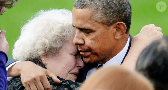 Barack Obama et Michelle Obama ont assisté à une cérémonie hommage aux victimes de la tuerie de Navy Yard, le 22 septmbre 2013 à Washington. Le couple a réconforté les familles et le président a délivré un discours.
