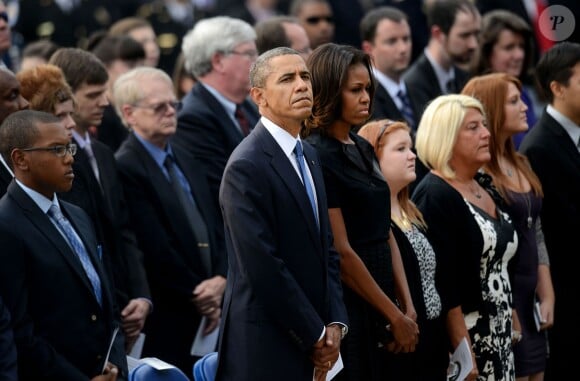 Barack Obama et sa femme Michelle Obama ont assisté à une cérémonie hommage aux victimes de la tuerie de Navy Yard, le 22 septmbre 2013 à Washington. Le couple a réconforté les familles et le président a délivré un discours.