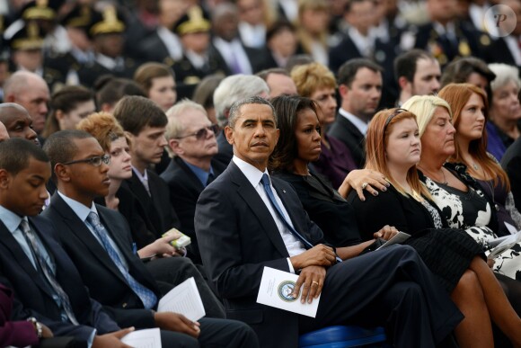 Barack Obama et Michelle Obama ont assisté à une cérémonie hommage aux victimes de la tuerie de Navy Yard, le 22 septmbre 2013 à Washington. Le couple a réconforté les familles et le président a délivré un discours.