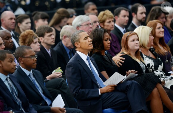 Barack Obama et Michelle Obama ont assisté à une cérémonie hommage aux victimes de la tuerie de Navy Yard, le 22 septmbre 2013 à Washington. Le couple a réconforté les familles et le président a délivré un discours.