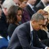 Barack Obama et la First Lady Michelle Obama ont assisté à une cérémonie hommage aux victimes de la tuerie de Navy Yard, le 22 septmbre 2013 à Washington. Le couple a réconforté les familles et le président a délivré un discours.