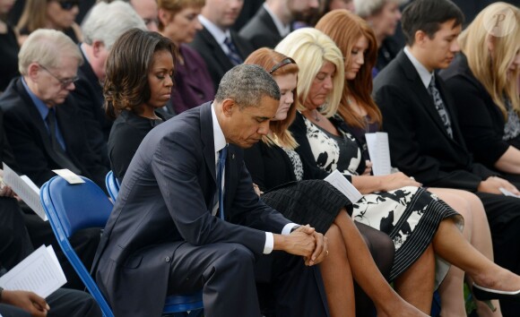 Barack Obama et la First Lady Michelle Obama ont assisté à une cérémonie hommage aux victimes de la tuerie de Navy Yard, le 22 septmbre 2013 à Washington. Le couple a réconforté les familles et le président a délivré un discours.
